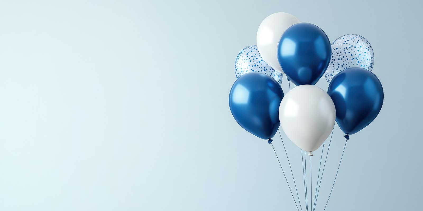 Colorful balloon arrangement with blue and white balloons creating a festive atmosphere for celebrations